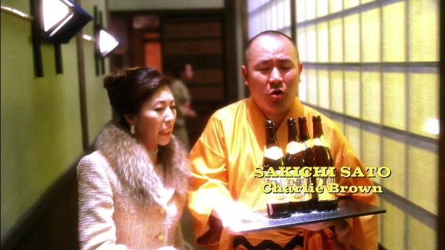 Wide shot frame from Kill Bill: Vol. 2 — coat, face, person