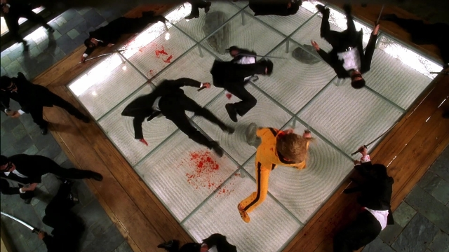 Frame from Kill Bill: Vol. 2 — standing, room, glass