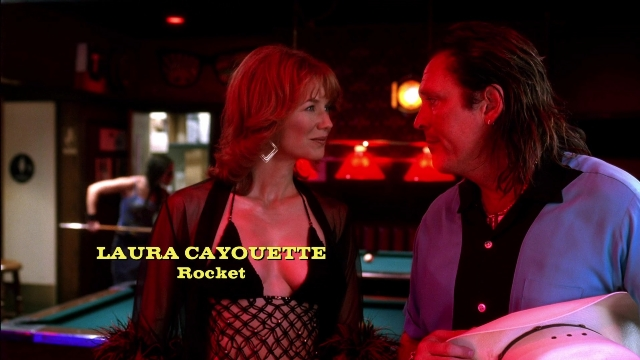 Wide shot frame from Kill Bill: Vol. 2 — standing, room, table