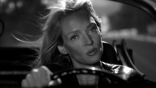 Wide shot frame from Kill Bill: Vol. 2 — sitting, street, car