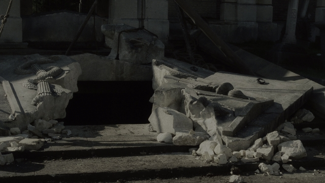 Wide shot frame from Sherlock Holmes — statue sculpture