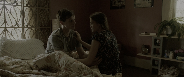 Wide shot frame from The Conjuring: The Devil Made Me Do It — sitting, room, dialogue