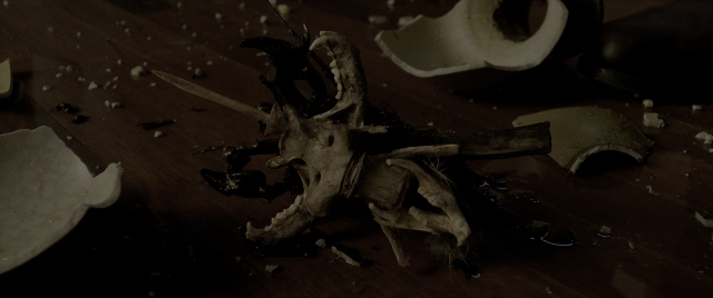 Wide shot frame from The Conjuring: The Devil Made Me Do It — skull