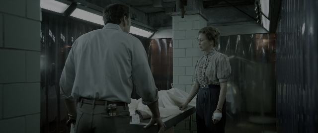 Wide shot frame from The Conjuring: The Devil Made Me Do It — standing, room, bed