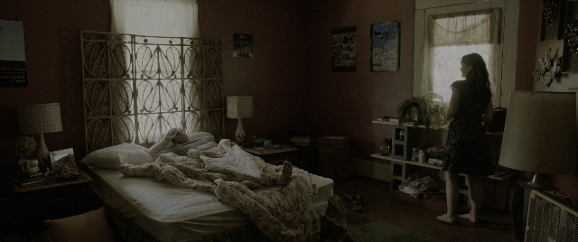 Wide shot frame from The Conjuring: The Devil Made Me Do It — room, bed, house