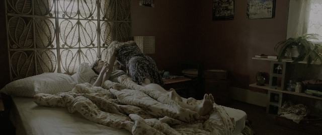 Wide shot frame from The Conjuring: The Devil Made Me Do It — room, bed, house