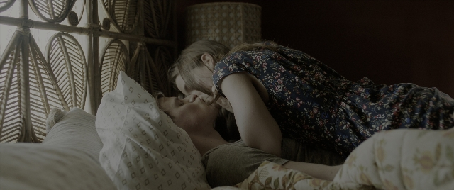 Wide shot frame from The Conjuring: The Devil Made Me Do It — bed, dress, shirt