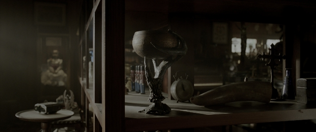 Wide shot frame from The Conjuring: The Devil Made Me Do It — room, table, lamp