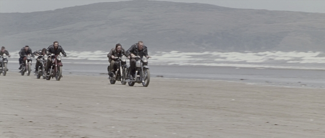 Wide shot frame from The World's Fastest Indian — bicycle, water, person
