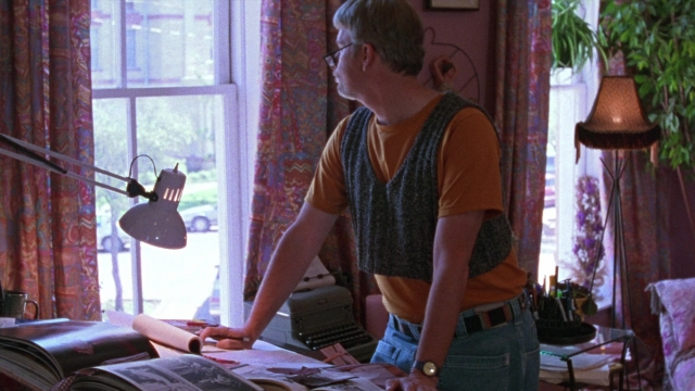 Wide shot frame from Waiting for Guffman — standing, room, bed