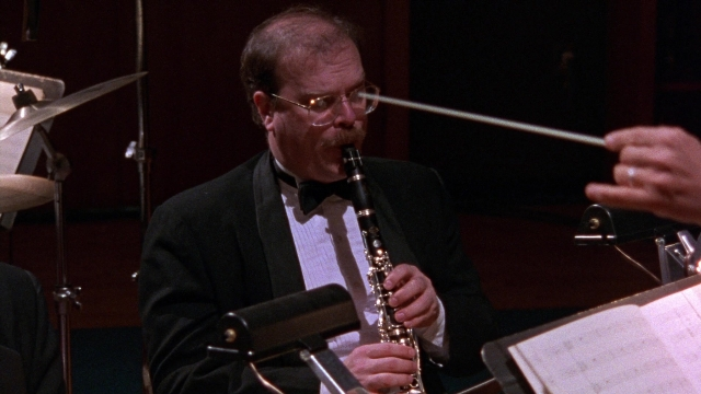 Frame from Waiting for Guffman — hand, mustache, person