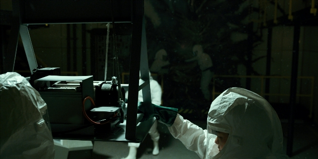 Wide shot frame from Stranger Things — standing, room, hat