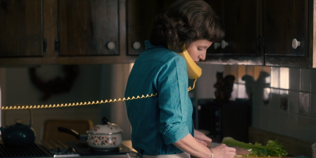 Wide shot frame from Stranger Things — standing, dialogue, phone