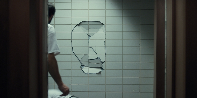 Frame from Stranger Things — standing, shirt, bathroom