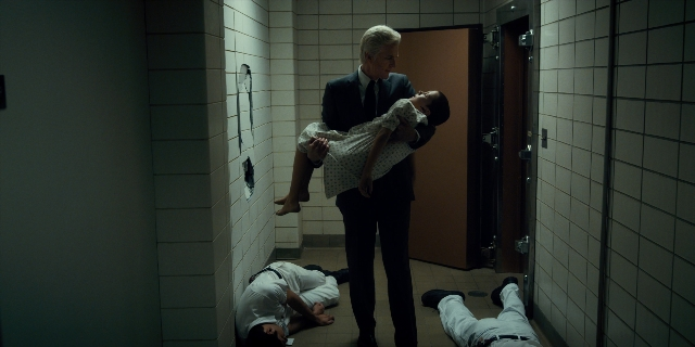 Frame from Stranger Things — standing, room, door