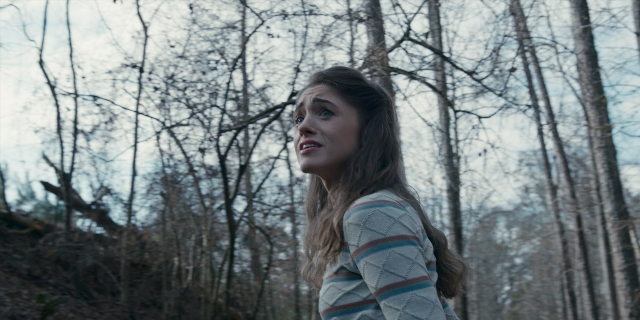 Wide shot frame from Stranger Things — standing, face, hair