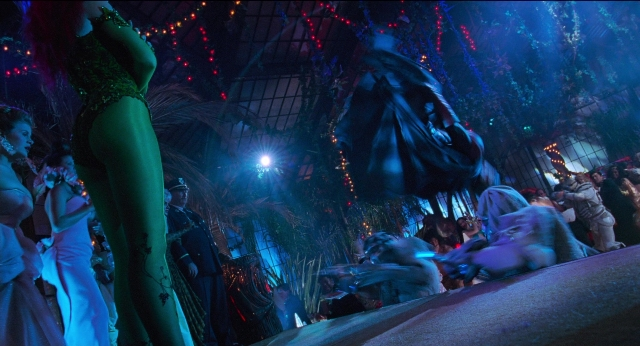 Wide shot frame from Batman & Robin — standing, person, human face