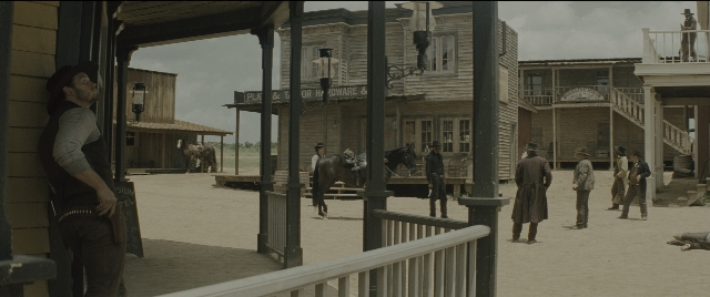 Wide shot frame from The Magnificent Seven — people, action, standing