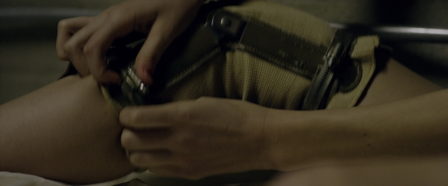Wide shot frame from 10 Cloverfield Lane — room, bed, bedroom