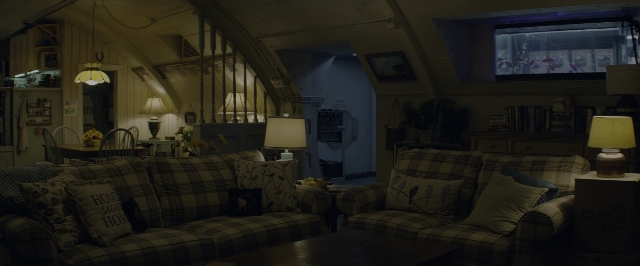 Frame from 10 Cloverfield Lane — room, table, house