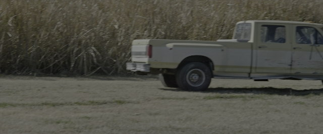 Wide shot frame from 10 Cloverfield Lane — bed, truck, wheel