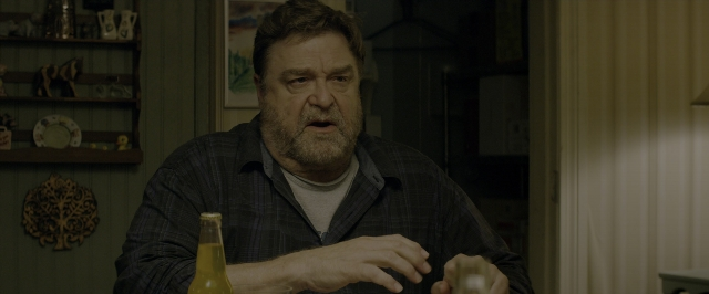 Medium shot frame from 10 Cloverfield Lane — sitting, table, kitchen