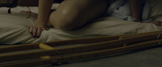 Frame from 10 Cloverfield Lane — bed, person