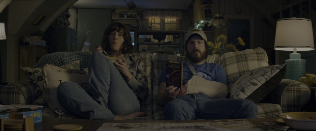 Wide shot frame from 10 Cloverfield Lane — sitting, plate, room