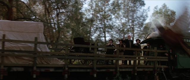 Wide shot frame from Unforgiven — standing, dialogue, person