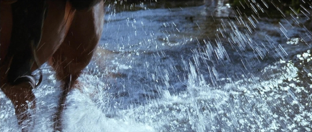 Wide shot frame from Unforgiven — water, fountain, person