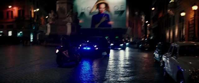 Medium shot frame from Zoolander 2 — walking, street, hat