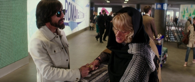 Wide shot frame from Zoolander 2 — standing, walking, coat