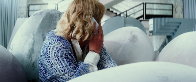 Wide shot frame from Zoolander 2 — sitting, hand, hair