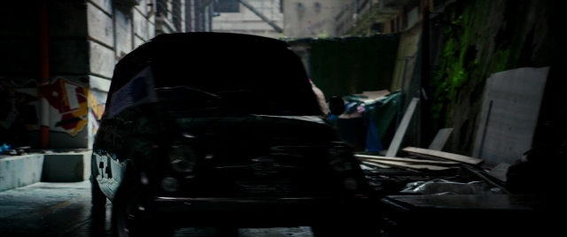 Wide shot frame from Zoolander 2 — car, night, wheel