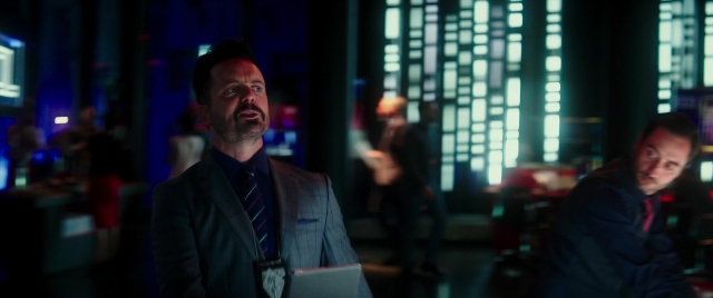 Wide shot frame from Zoolander 2 — room, hand, suit