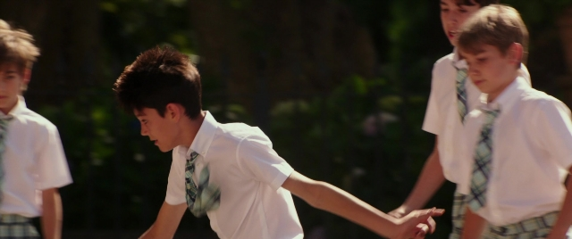 Wide shot frame from Zoolander 2 — standing, hand, face