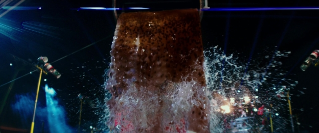 Wide shot frame from Zoolander 2 — night, water, fountain