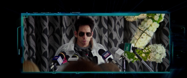 Wide shot frame from Zoolander 2 — sitting, table, dialogue