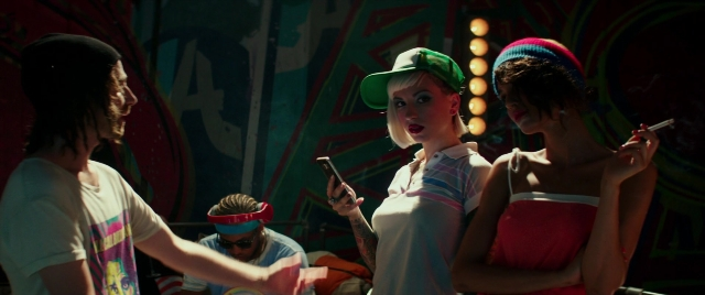 Wide shot frame from Zoolander 2 — standing, room, phone