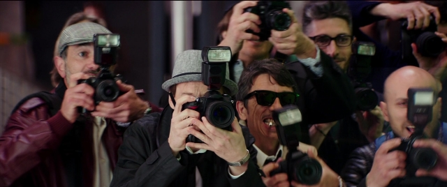 Wide shot frame from Zoolander 2 — hat, camera, person