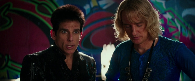 Wide shot frame from Zoolander 2 — sitting, shirt, face