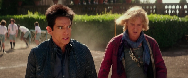 Wide shot frame from Zoolander 2 — standing, walking, jacket