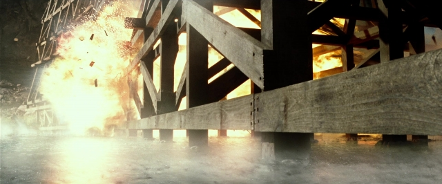 Wide shot frame from The Lone Ranger — fire, water, smoke