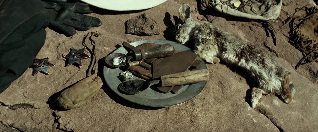 Wide shot frame from The Lone Ranger — plate, table, animal