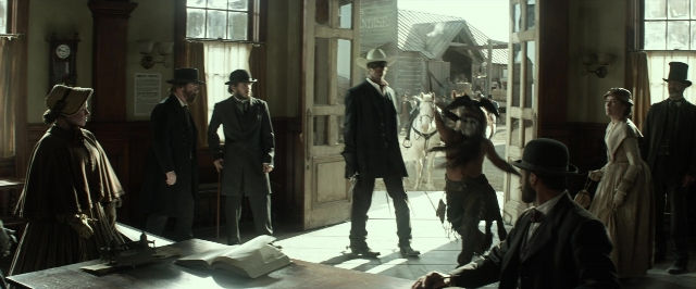 Wide shot frame from The Lone Ranger — book, standing, walking