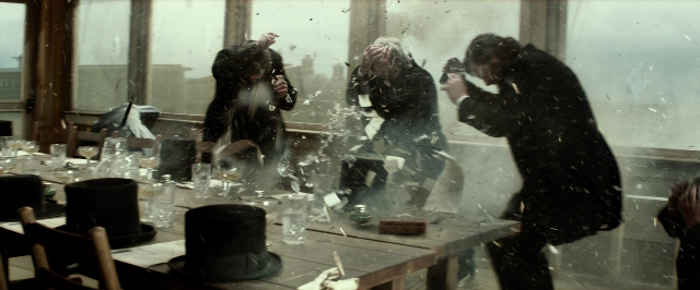 Wide shot frame from The Lone Ranger — table, dialogue, restaurant
