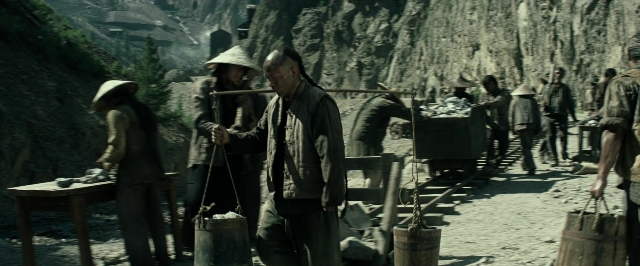 Wide shot frame from The Lone Ranger — table, person, human face
