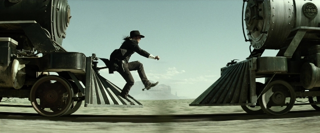 Wide shot frame from The Lone Ranger — hat, suit, face