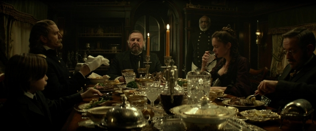 Wide shot frame from The Lone Ranger — sitting, room, table