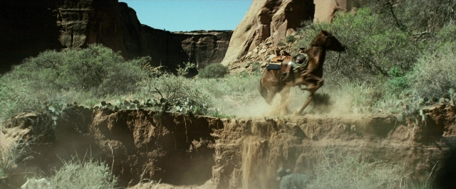 Wide shot frame from The Lone Ranger — hat, coat, horse